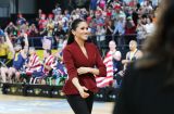 Меган Маркл подчеркнула беременный живот блузой с баской